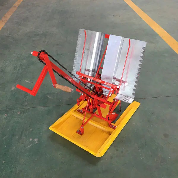 Rare Machinery manual paddy rice transplanter with a red frame and yellow base for efficient planting