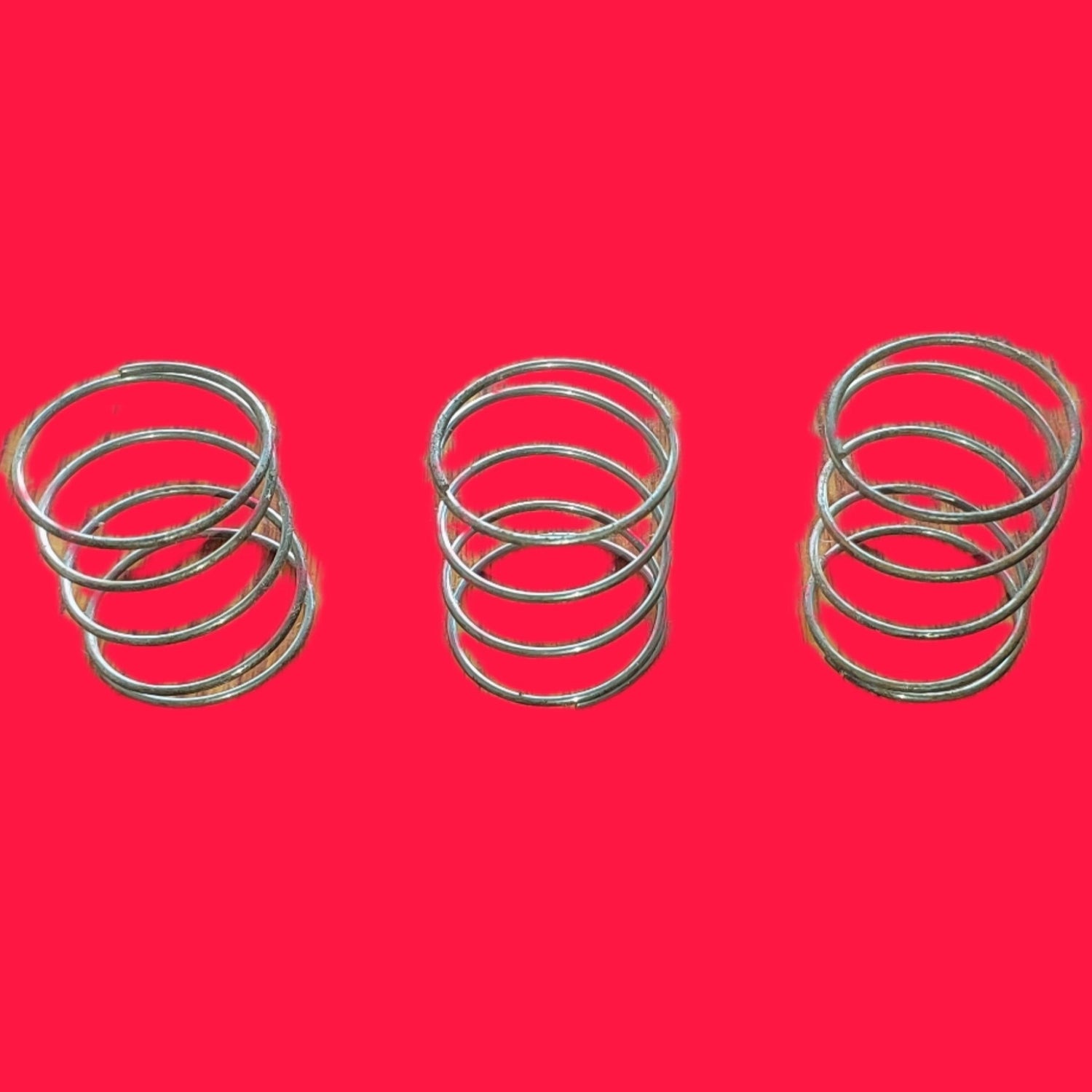 Set of three metal springs for mini rice mill spare parts by Rare Machinery